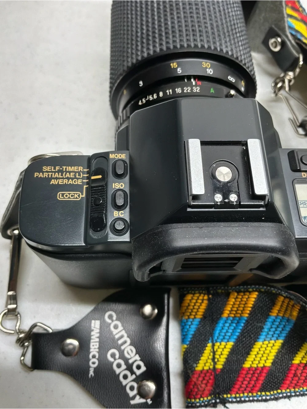Canon T70 35mm SLR Camera with Black Telephoto Lens and Accessories